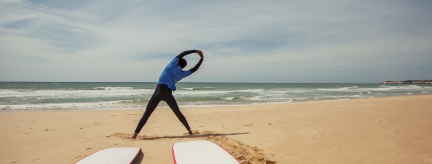 Yoga on beach considerations for surfing